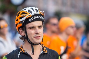 Man wearing cycling helmet and black shirt